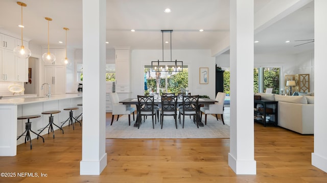 dining area with recessed lighting and light wood finished floors