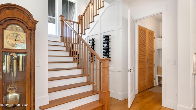 stairway featuring wood finished floors