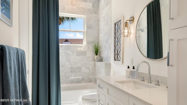 bathroom with vanity, toilet, and tub / shower combination