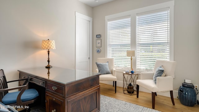 home office with light wood-type flooring