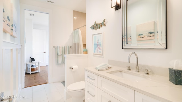 full bathroom featuring visible vents, curtained shower, toilet, tile patterned floors, and vanity