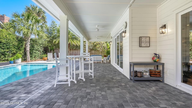 view of patio featuring a fenced in pool and fence