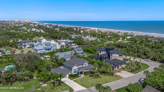 bird's eye view featuring a water view and a view of the beach