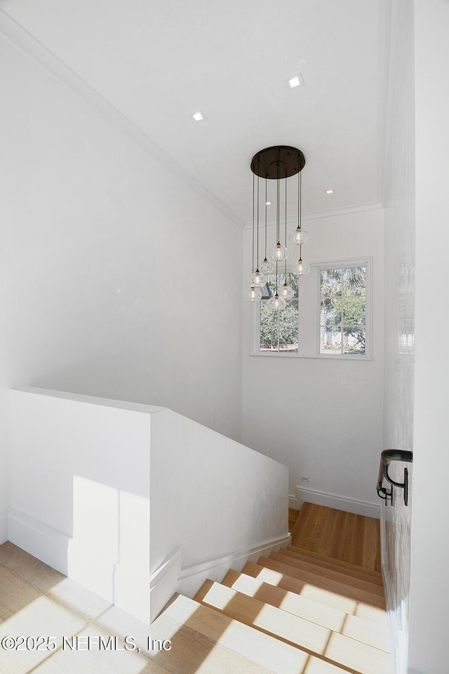 staircase with recessed lighting, crown molding, and baseboards