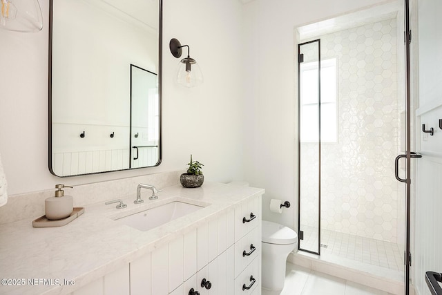 bathroom with toilet, tile patterned floors, a shower stall, and vanity