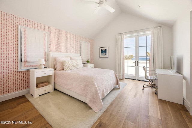 bedroom with wallpapered walls, access to outside, and light wood-style flooring