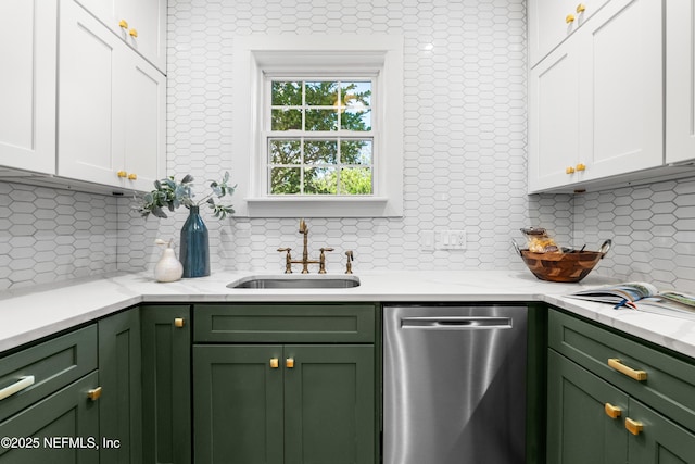 kitchen featuring green cabinets, a sink, white cabinets, and dishwasher
