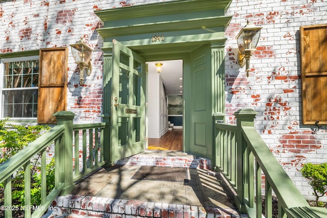 property entrance with brick siding