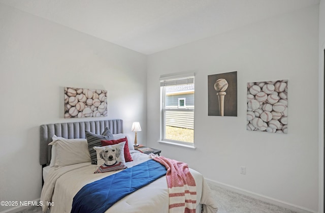 carpeted bedroom featuring baseboards