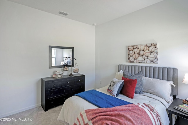 carpeted bedroom with baseboards and visible vents