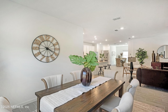 dining space with visible vents, recessed lighting, and baseboards