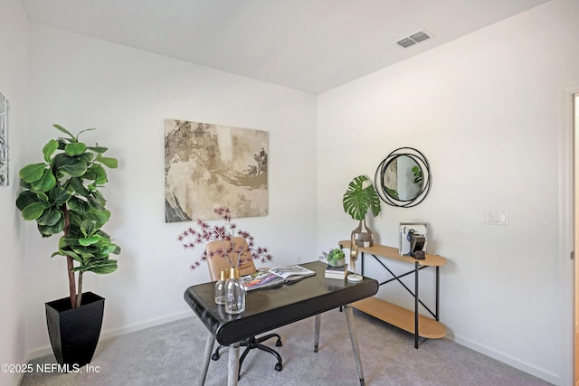 office space featuring visible vents, baseboards, and carpet