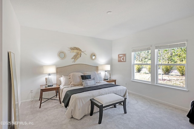 bedroom with carpet flooring and baseboards