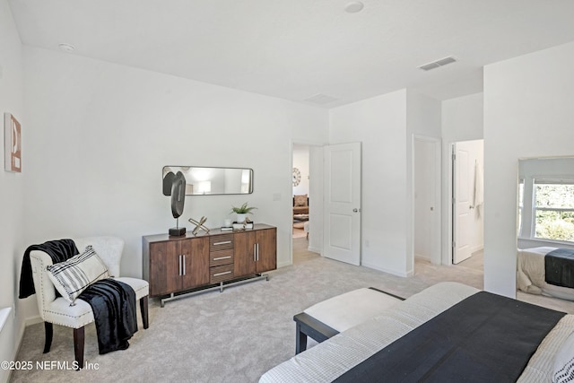 bedroom with light colored carpet and visible vents