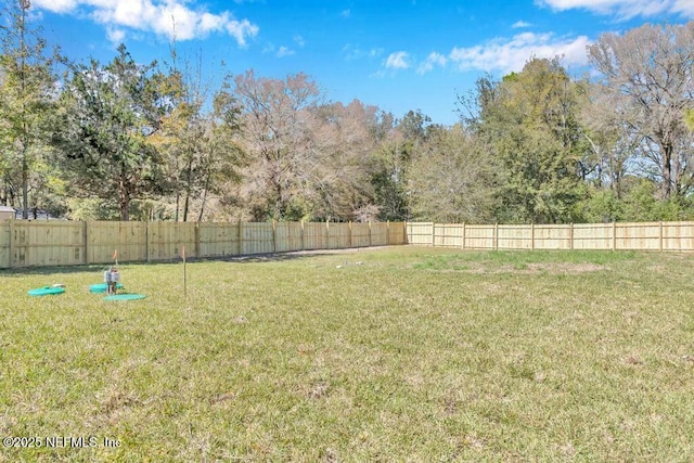 view of yard featuring a fenced backyard