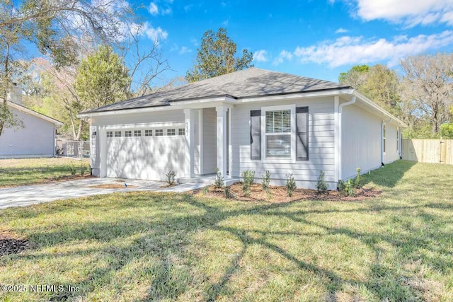 view of front facade with a garage, driveway, fence, and a front lawn