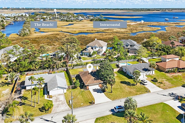 bird's eye view with a residential view and a water view