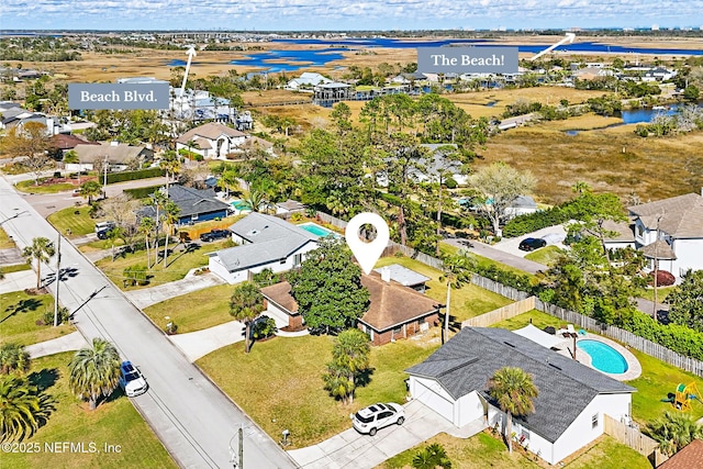 aerial view with a residential view and a water view