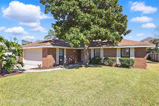 single story home featuring a front lawn, brick siding, and an attached garage