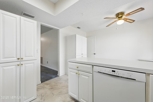 kitchen with visible vents, ceiling fan, light countertops, dishwasher, and marble finish floor