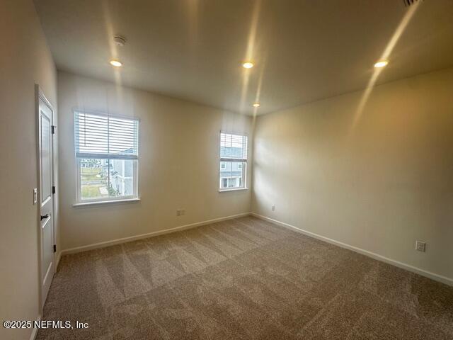 unfurnished room featuring carpet flooring, recessed lighting, and baseboards