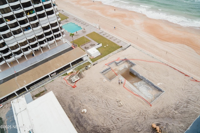 aerial view featuring a water view and a view of the beach