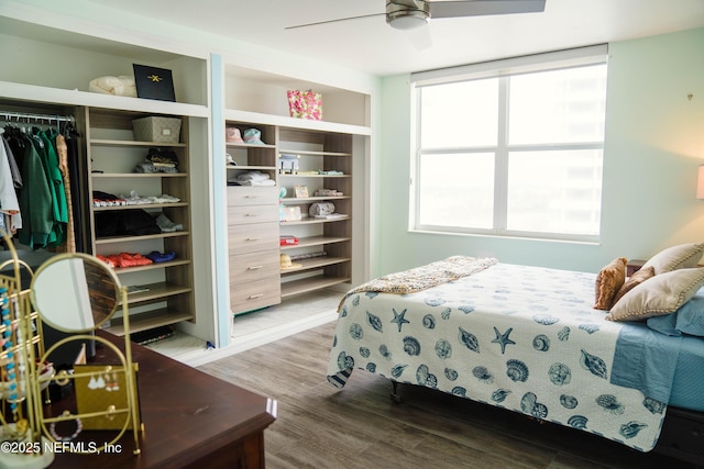 bedroom with ceiling fan and wood finished floors