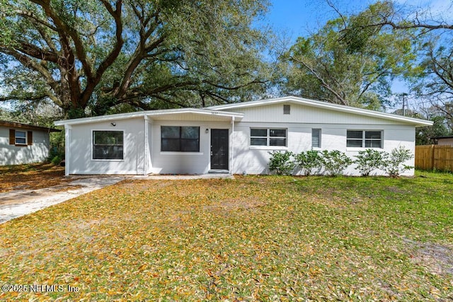 view of front of property with fence and a front yard