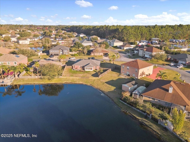 aerial view featuring a water view and a residential view