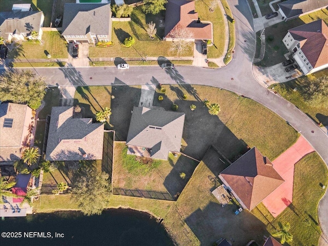 aerial view featuring a water view and a residential view