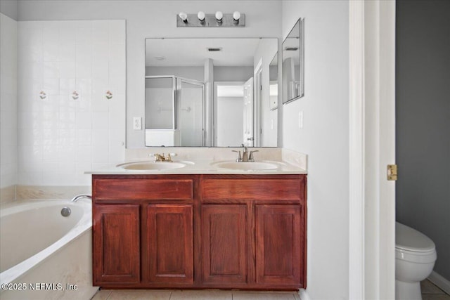 full bathroom with double vanity, a shower stall, a sink, and a bath