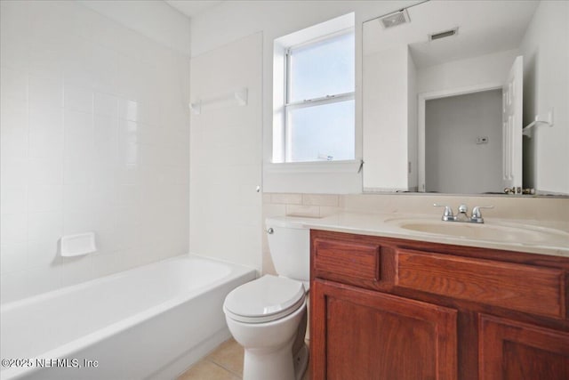 full bath with toilet, vanity, visible vents, tub / shower combination, and tile patterned floors