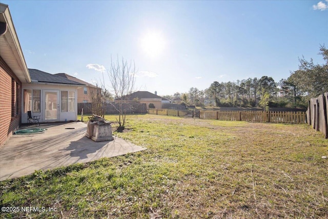 view of yard featuring a patio area and a fenced backyard