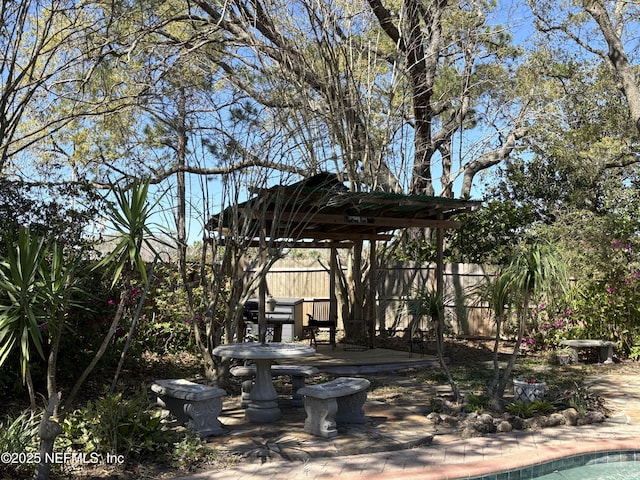 view of yard with a gazebo, a patio, and fence