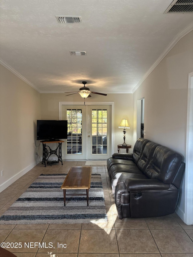 living area with visible vents and crown molding