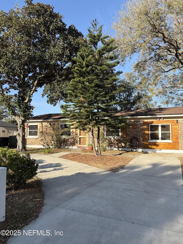 view of front of home featuring concrete driveway