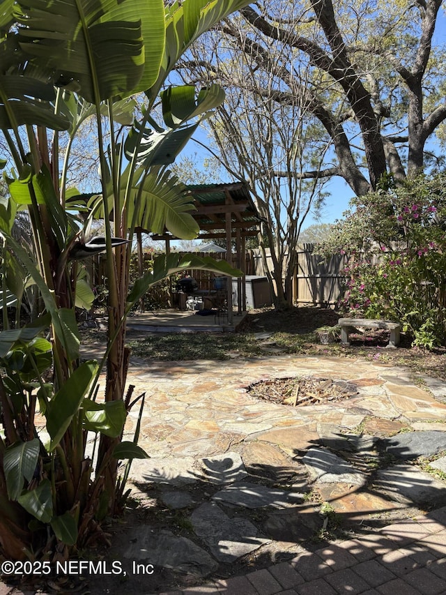 view of patio featuring fence