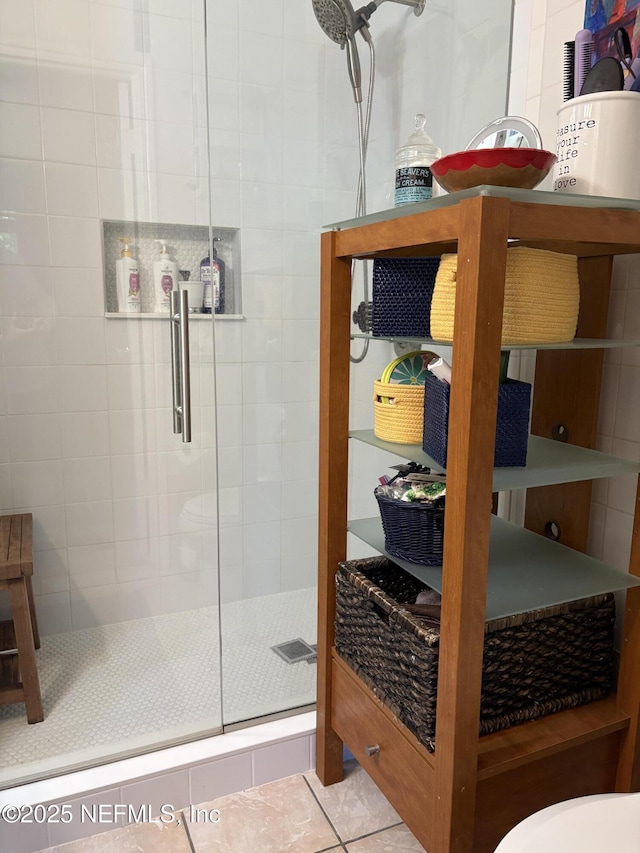 full bath with tile patterned flooring and a stall shower