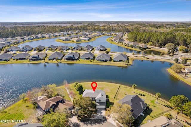 aerial view with a residential view and a water view