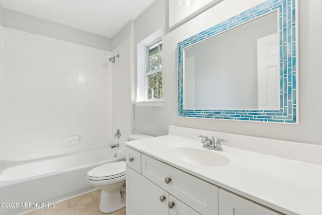 bathroom with tile patterned floors, toilet, vanity, and bathing tub / shower combination