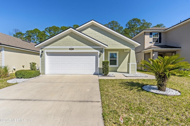 craftsman-style home with driveway, an attached garage, and a front lawn