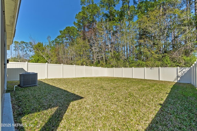 view of yard with cooling unit and a fenced backyard