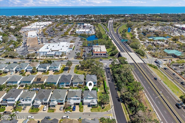 aerial view featuring a residential view and a water view