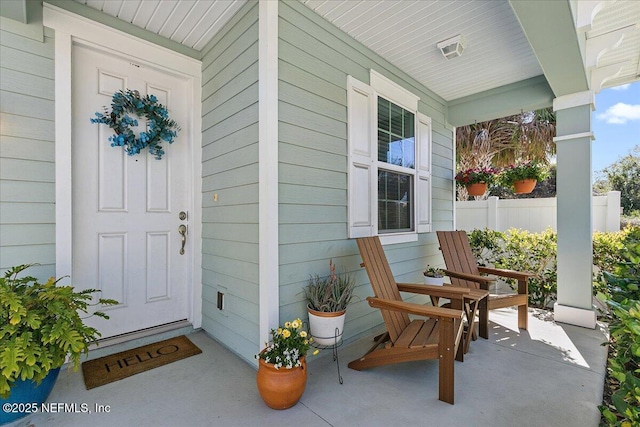 entrance to property featuring a porch