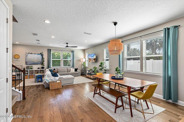 dining area featuring stairs, recessed lighting, visible vents, and wood-type flooring