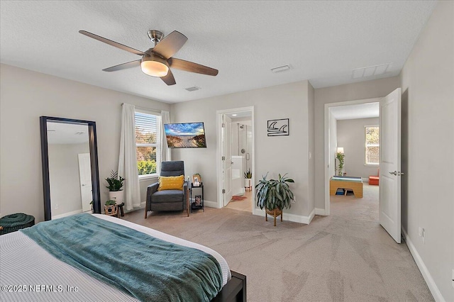 carpeted bedroom featuring visible vents, ceiling fan, a textured ceiling, and baseboards