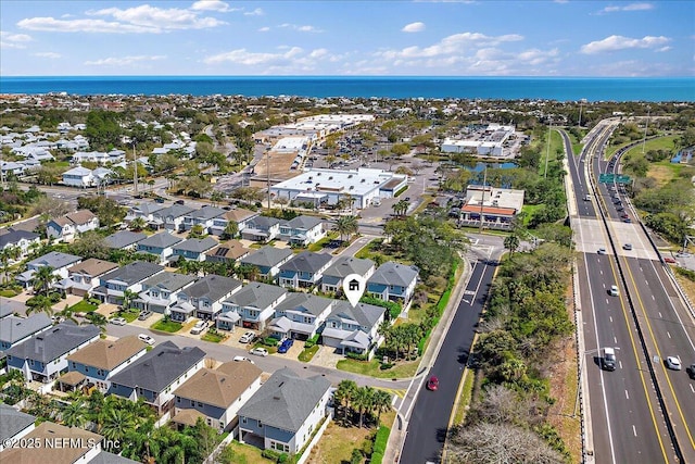 aerial view with a residential view and a water view