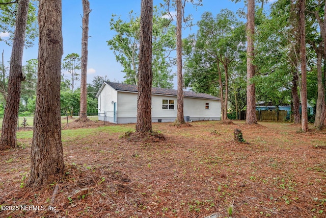 exterior space featuring fence and crawl space