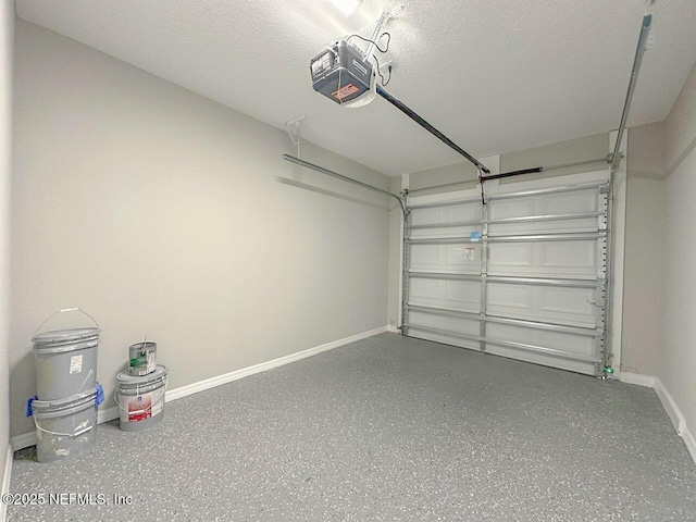 garage with baseboards and a garage door opener