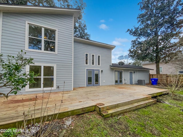 back of house featuring a deck, french doors, central AC, and fence